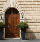 Double wood door with arched top